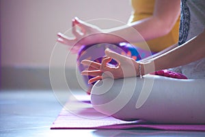 Closeup of women hands in mudra gesture practice yoga indoor