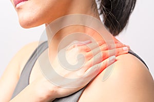 Closeup women neck and shoulder pain/injury with red highlights on pain area with white background, healthcare and medical concept