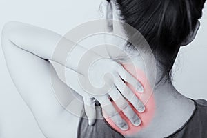 Closeup women neck and shoulder pain/injury with red highlights on pain area with white backgrounds, healthcare and medical