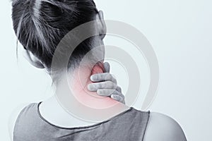 Closeup women neck and shoulder pain/injury with red highlights on pain area with white backgrounds, healthcare and medical