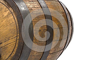 Closeup of wood barrel with steel rings on white