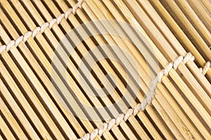 Closeup wooden bamboo straw mat for cooking sushi food asia