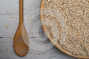 Closeup of a wooden bowl of oats