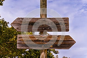 Closeup of wooden direction signs in Valle de Alcudia, Spain