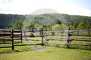 Closeup of wooden fence on a corral farmland rural scene