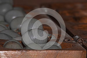 Closeup of a wooden mancala game