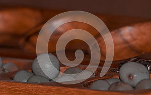 Closeup of a wooden mancala game