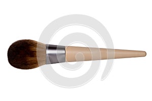 Closeup of a wooden new professional makeup brush isolated on a white background. Concept beauty. Macro.