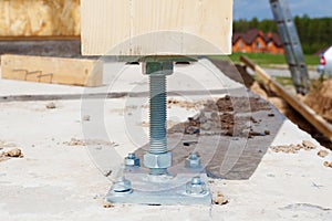 Closeup of wooden pillar on the construction site with screw. Wooden Pillars are structures that can be placed on Foundations or