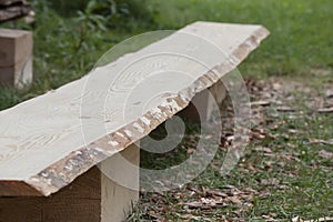 Closeup of wooden plank of pine without peel before abrading process