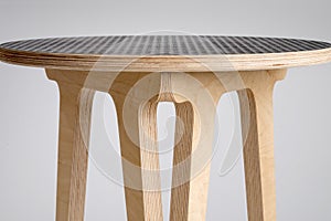 Closeup of Wooden Stool with Black Vinyl Covering on Top