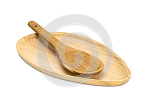 Closeup of wooden tray and wooden spoon on white background