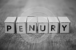 wooden word on wooden table background : penury