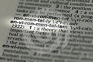 Closeup of a word environmentalism highlighted in dictionary