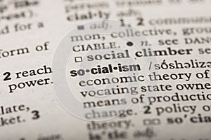 Closeup of the word `Socialism` in a dictionary