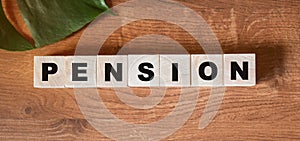 Closeup of word on wooden cube on wooden desk background concept