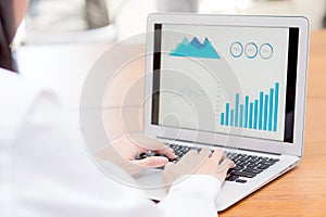 Closeup work with finance analysis and planing data on laptop