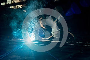 Closeup worker doing the welding in a workshop