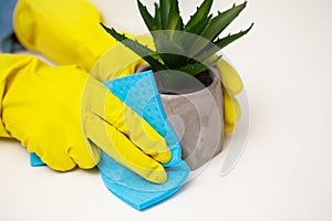 Closeup of worker hand wiping dust in office