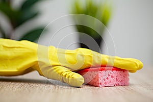 Closeup of worker hand wiping dust in office