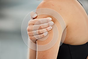 Closeup, workout and woman with shoulder pain, injury and inflammation with muscle tension, sports accident and