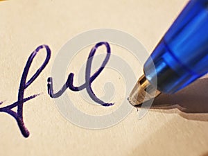 Closeup of writing with blue ballpoint pen