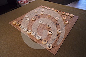 Closeup of Xiangqi board with pieces. Chinese chess or elephant chess.