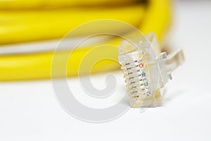 Yellow network cable with RJ 45 plug.