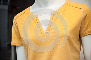Yellow teeshirt for women in store showroom photo