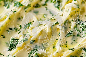 Closeup of yellow texture of creamy butter or margarine with herbs and rosemary for sandwiches and steak as background