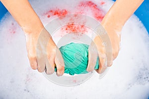 Female squeeze wring out wet fabric cloth photo