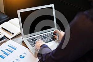 Closeup of Young business man working at office with laptop and