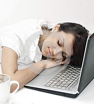 Closeup.young business woman sleeping on the laptop keyboard