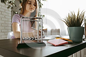 Closeup of young businesswoman working at modern office making notes