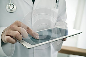 Doctor man checking a chest radiograph photo