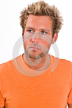 Closeup of young Caucasian male in a bright orange t-shirt