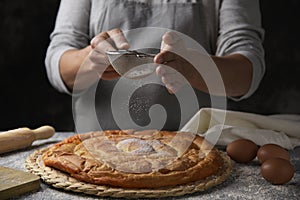 Man preparing ensaimada typical of Mallorca, Spain photo