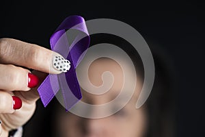 Purple ribbon against the violence against women