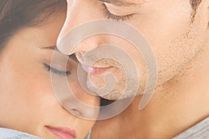 Closeup of young couple embraced