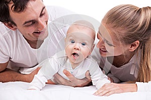 Closeup of young family with baby boy over white