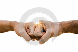 Closeup young man fist bump on the sky background. Friendship & Teamwork Concept