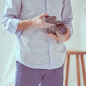 Man holding camera photo