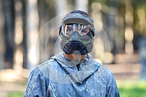 Closeup of young man in paintball mask
