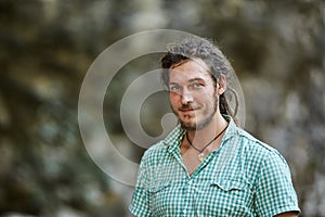 Young rastafari in closeup outdoor photo