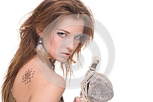 Closeup of young savage woman with stone hammer