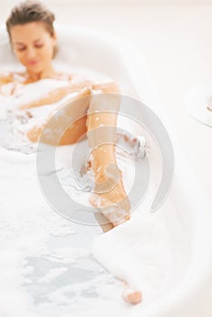 Closeup on young woman relaxing in bathtub