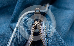 Closeup of zipper in blue jeans. Zipper lock. A piece of denim