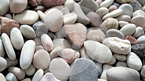 Closeupbackground of a collection of pebbles arranged in texture