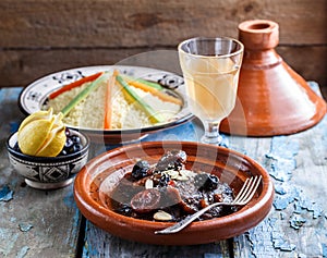 Closeview of tajine of beef with prunes and almonds. In tradiotional Moroccan dish.