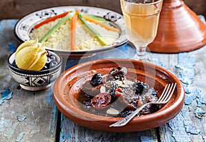 Closeview of tajine of beef with prunes and almonds. In tradiotional Moroccan dish.